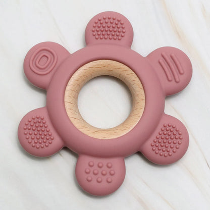Jouet sensoriel K-BABY en silicone rose et bois naturel, texture idéale pour calmer les gencives de bébé